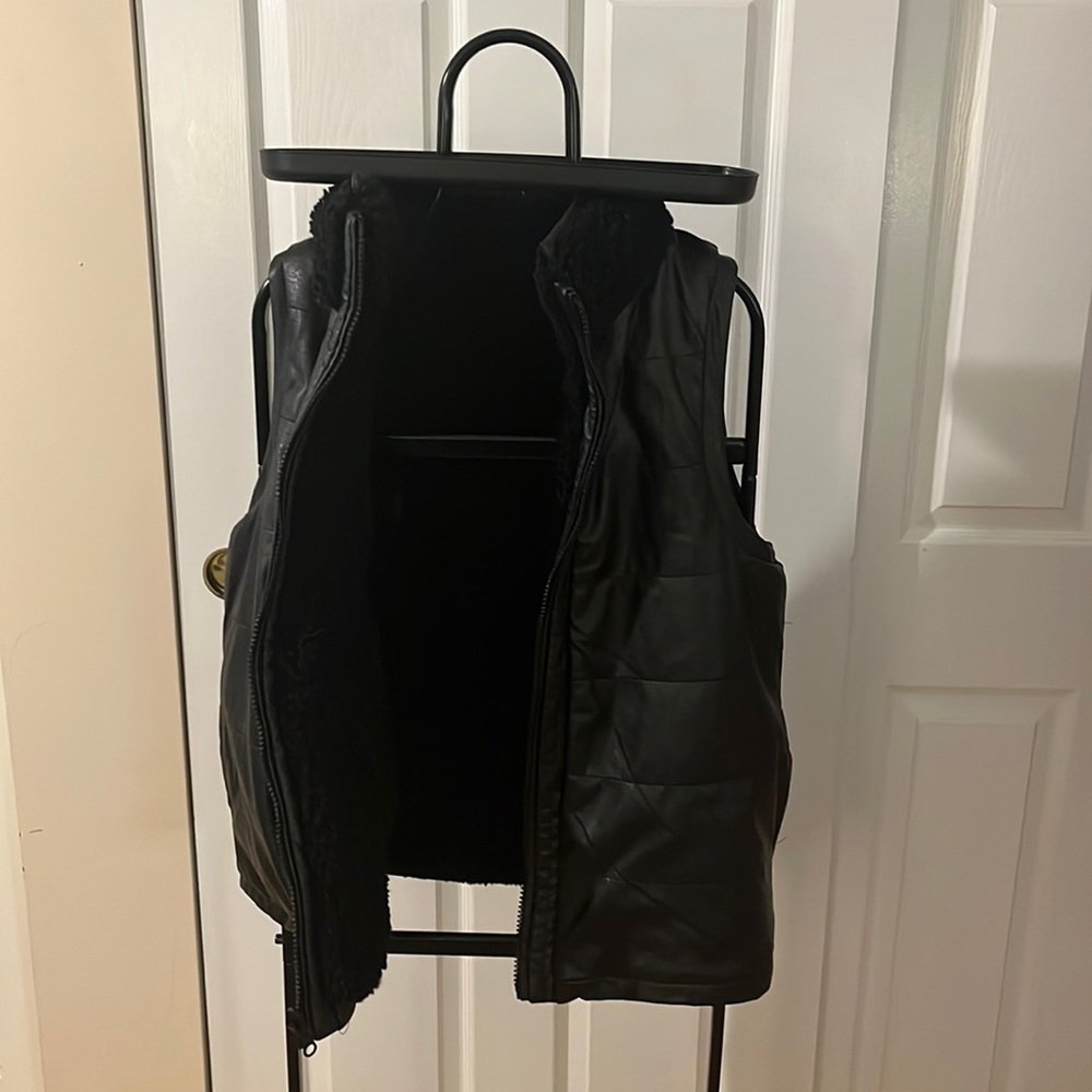 Black reversible Tuckernuck cold weather vest.